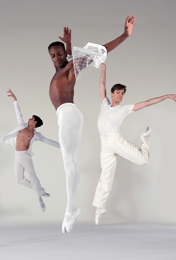 male dancers jump in air